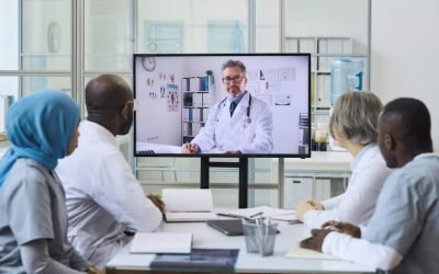 mature-doctor-screen-having-video-call-with-his-colleagues-online-meeting-office_249974-16477